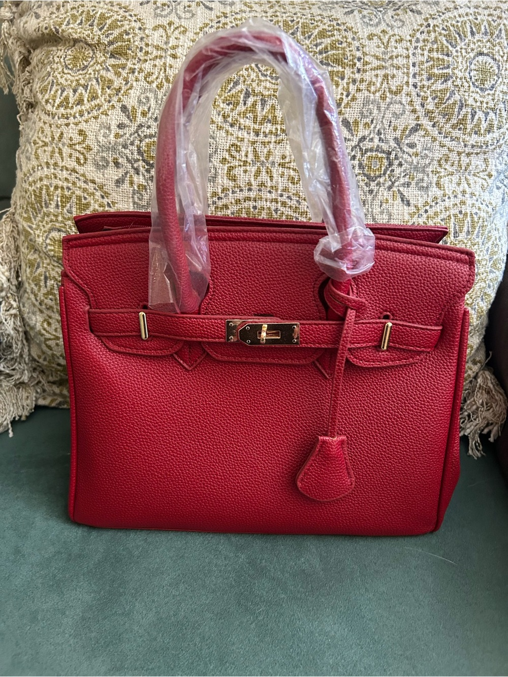 Small faux leather handbag with strap. Designer inspired.